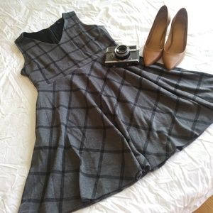 A plaid dress with built-in pockets